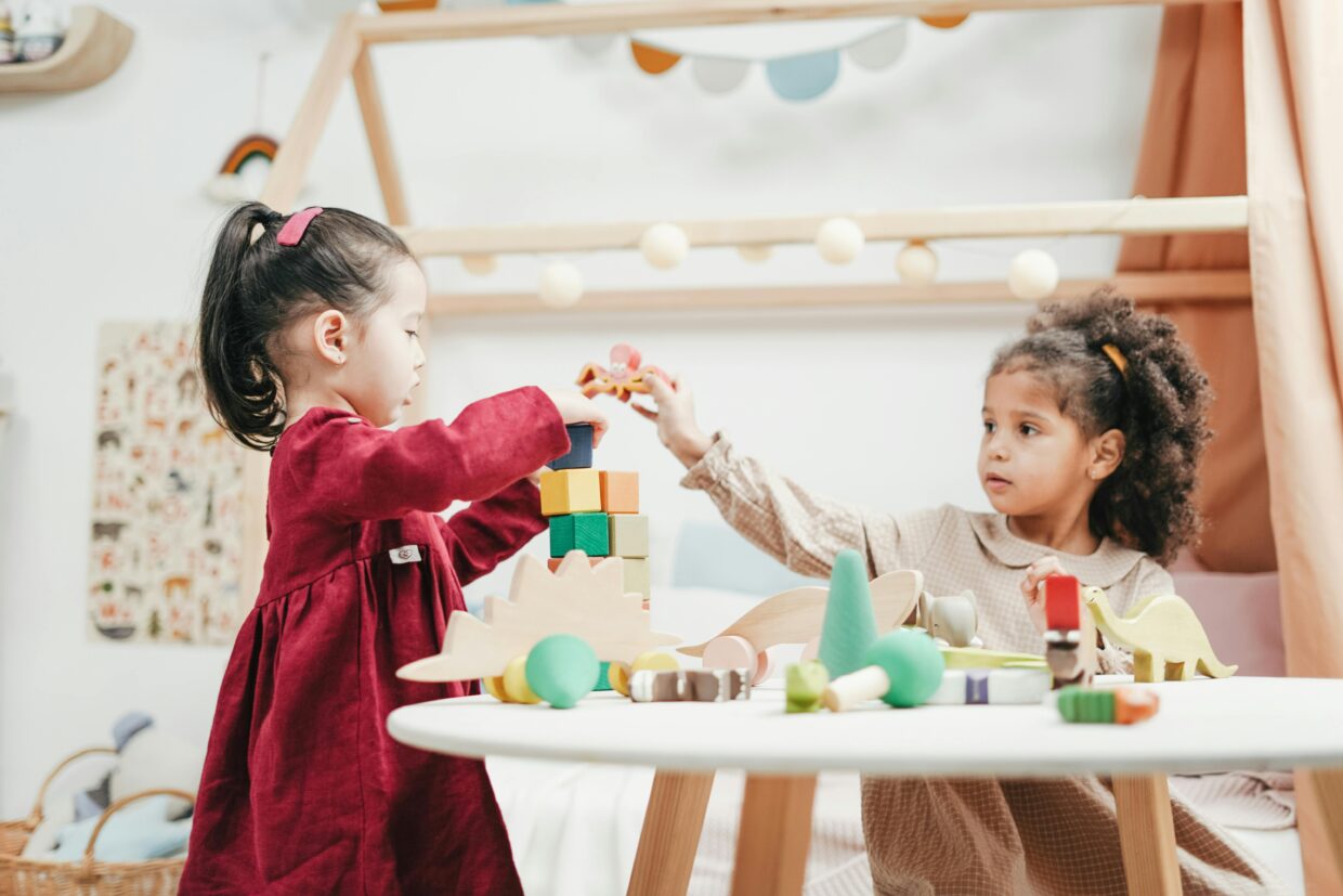 Children doing fun craft activities together at a table with art supplies