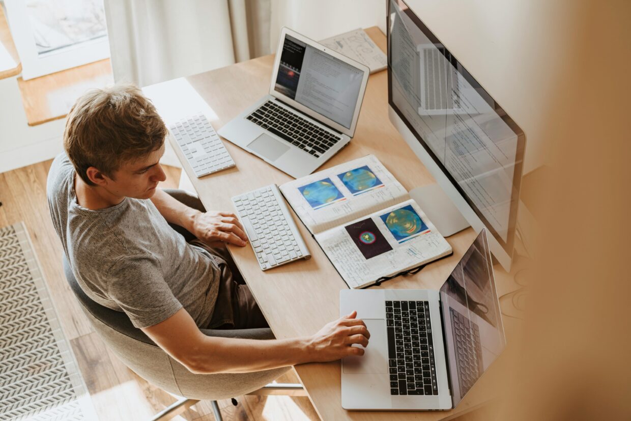 Teen girl sitting at a clean and organized bedroom desk studying