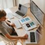 Teen girl sitting at a clean and organized bedroom desk studying